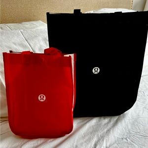 Official Lululemon shopping bags. Large black, small red. Sold together.